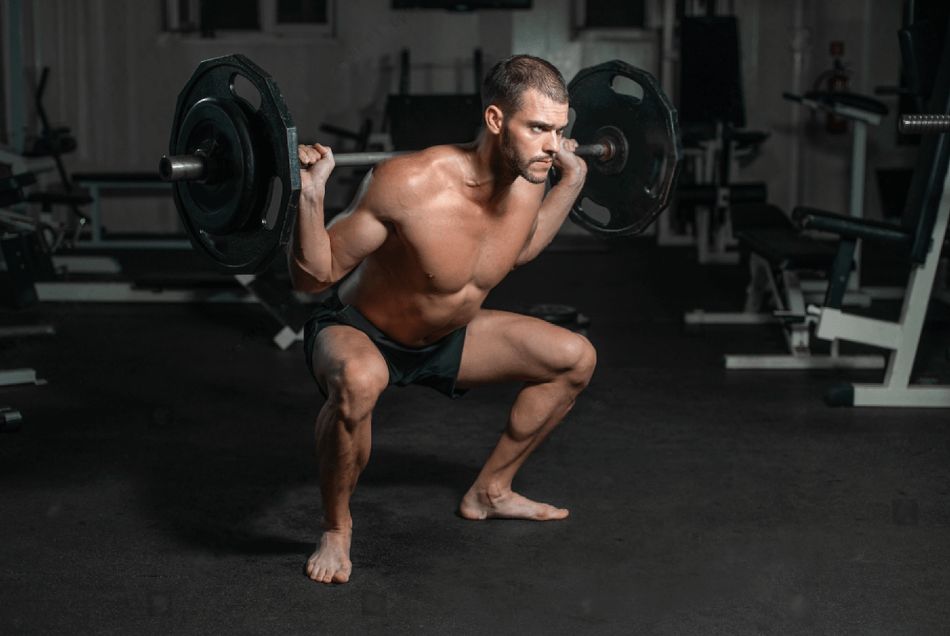 Handsome weightlifter lifting barbells with Squats. Male training with barbell pumping legs