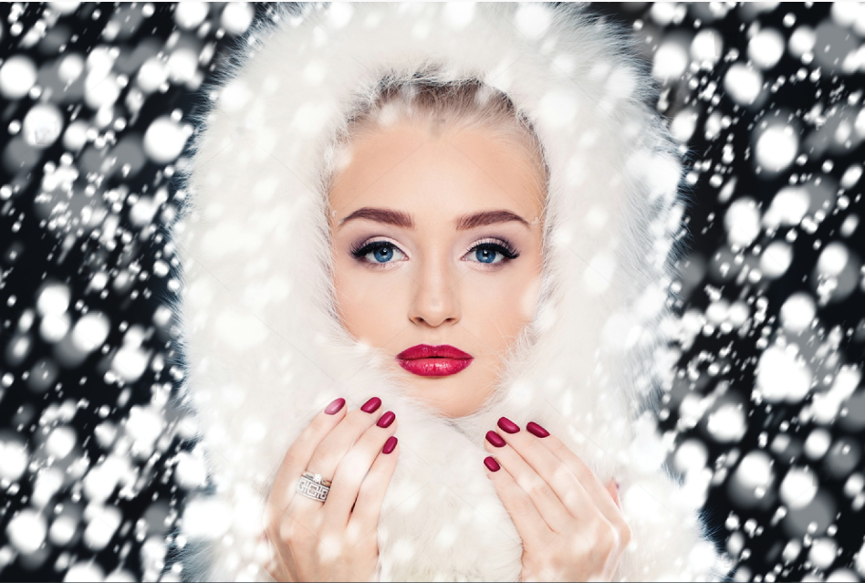 fashion woman on snowfall winter background